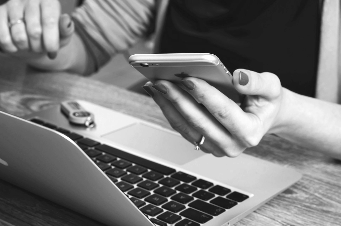 woman holding silver iPhone 6